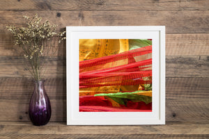 Printed Tibetan prayer flags form an intricate square composition of colour and fabric texture.