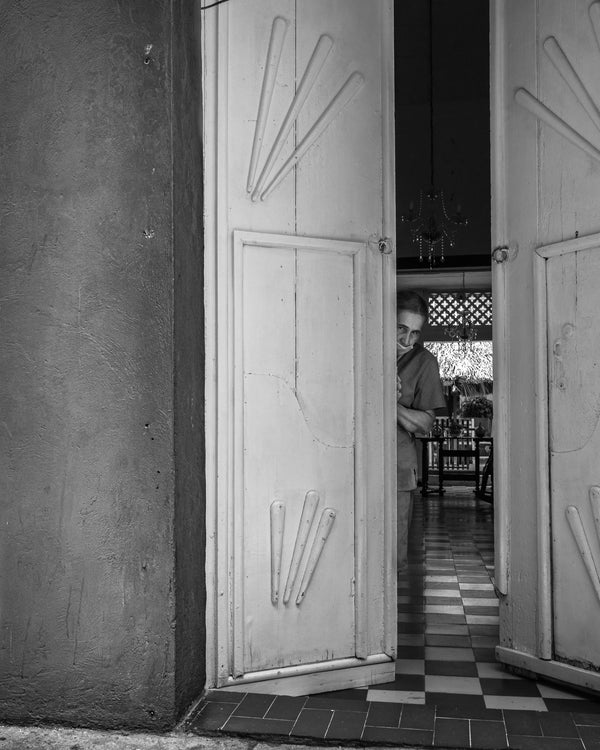 Columbian lady closing the door | Photo Art Print fine art photographic print