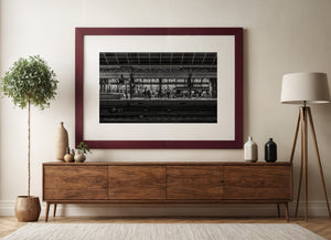 Nighttime train boarding scene at Amsterdam Central Station platform