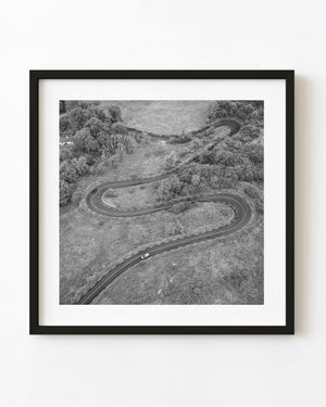 Black and white aerial photograph of the winding road at Corkscrew Hill, Ireland.
