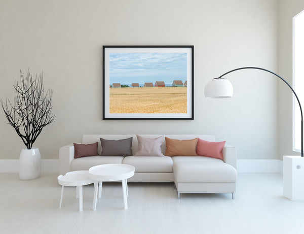 Coastal homes in PEI Canada with wheat field wall art