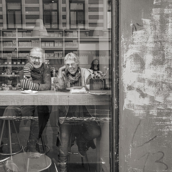 Women laughing in Oslo café