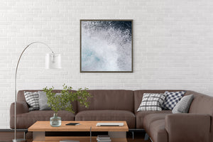 A dense cloud of sea spray reveals the texture and force of breaking water.