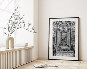 symmetrical view of catholic church nave with checkerboard stone floor