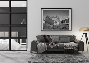 crumbling wooden barn black and white photo