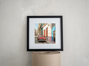 Colonial street architecture and antique automobile
