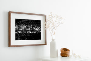 Black and white photo art print featuring repetitive glass bottles in Cuba