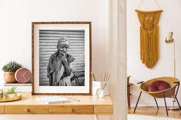 Elderly woman with walking stick in Southern India – black and white