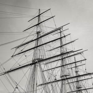 Overlapping ship masts and spars create a detailed rigging pattern in a square composition.