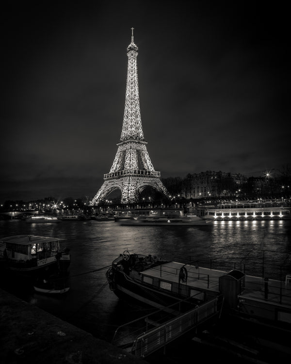 Black and white Eiffel Tower lit up