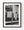 A hanging bank sign and wooden balcony frame a historic Dawson City facade in monochrome.