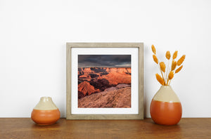 Orange canyon terraces descend into deep shadows at Dead Horse Point State Park.