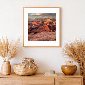 Rocky ledges and distant overlapping ridges reveal the scale of Utah’s canyon landscape.