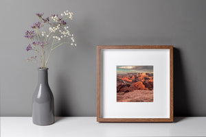 Warm sandstone tones contrast with a soft cloudy sky above the Dead Horse Point overlook.