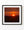 A bright sun rises above dark rural Quebec fields beneath a deep red and orange sky.