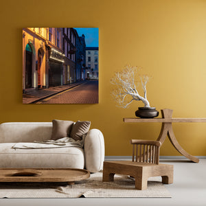 Colour photograph of Derry architecture with hanging baskets and receding pavement.