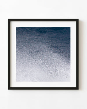 White ocean spray against deep blue water in the Drake Passage