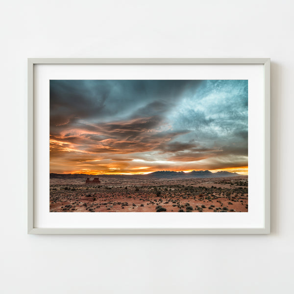 tranquil desert sunset with vibrant orange clouds