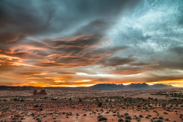 serene desert landscape under fiery sunset sky
