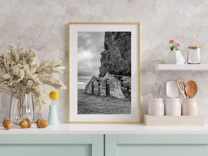 Vertical black and white view of Drangshlid houses and rock face