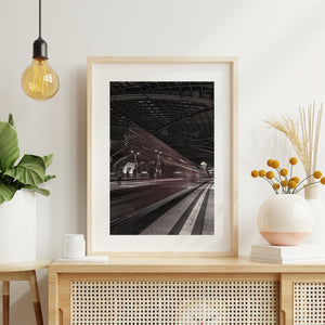 Vertical railway photograph with moving train and sharp platform edges