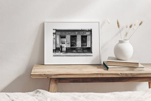 Black and white photograph of daily street life outside Sutcliffe House in Dublin