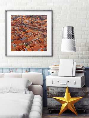 Colour photograph of closely packed orange rooftops in Dubrovnik