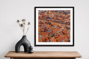 Pale stone buildings and terracotta rooftops in a dense Dubrovnik cityscape
