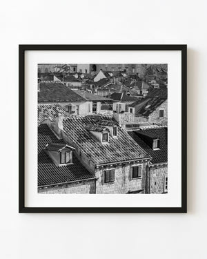 Dubrovnik old town rooftops and stone buildings photographed in black and white