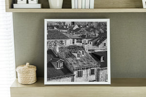 Black and white Croatian cityscape with sloping roofs and pale stone walls