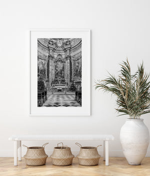 Tall columns and religious paintings inside St Ignatius Church in Dubrovnik