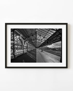 Dunedin train station platform and steel canopy in black and white