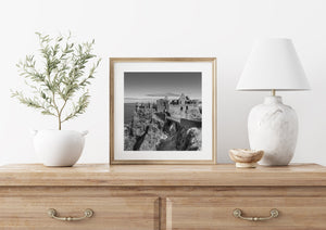 Historic cliffside ruins black and white