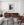 Monochrome Dutch farmhouse scene with a chair and wooden floor