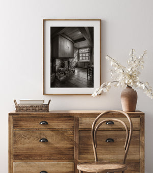 Traditional Dutch hearth beneath heavy wooden ceiling beams