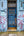 Blue doorway and graffiti on a worn East London facade