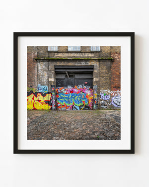 Colourful graffiti across the Cooperage doors in East London