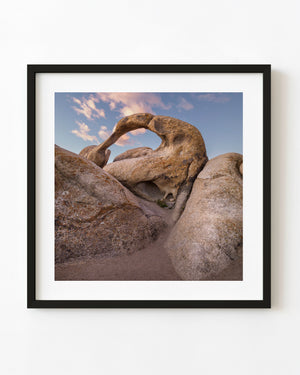 Natural rock arch framing blue sky in the Eastern Sierra