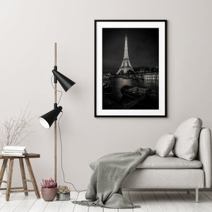 Monochrome Eiffel Tower and riverside lights reflected in the Seine