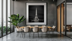 Square monochrome photograph of the Eiffel Tower and riverside lights in Paris