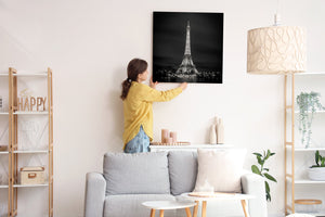 Black sky framing lit Paris iron tower