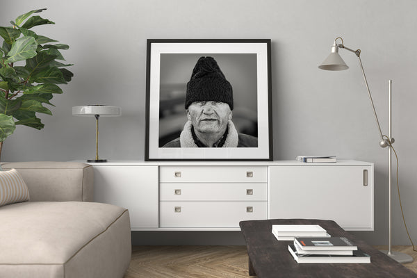 Weathered face of elder man in Romania – black and white photo