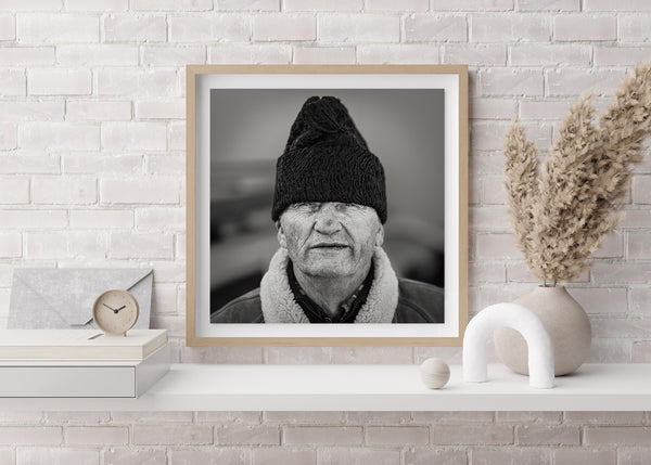 Close-up portrait of Romanian man in winter clothing – black and white