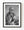 Elderly woman with a walking stick and raised hand in a black and white India street portrait.