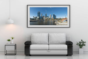 A broad waterfront view of Perth with towers and lower buildings along Elizabeth Quay.
