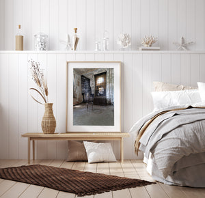 Peeling paint and a solitary wooden chair in the former Ellis Island hospital.