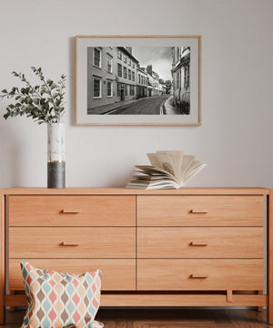 Old English town architecture along curved road