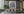 Clouds hang above a field of tall Everglades grass in monochrome.