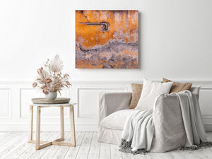 Bent metal piping stands out against cracked orange plaster and worn masonry.