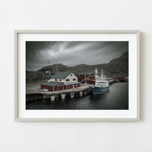 Fishing vessel docked at Mortsund harbor in Lofoten Norway